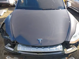 2021 Tesla Model Y Long Range with VIN 5YJYGDEE5MF191142, listed as a IAAI auction lot 41448514 with 71,626 mi miles. Bid and sale history available at carsss.com. Image 10.