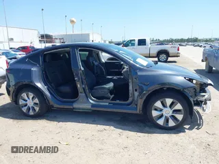 2024 Tesla Model Y with VIN 7SAYGDED2RF040745, listed as a IAAI auction lot 41986613 with 9,778 mi miles and . Bid and sale history available at DreamBid. Image 13.