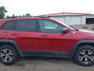 2015 Jeep Cherokee Trailhawk with VIN 1C4PJMBS6FW575517, listed as a IAAI auction lot 42661199 with 299,166 mi miles and . Bid and sale history available at DreamBid. Image 13.