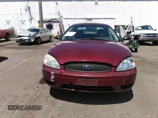 2005 Ford Taurus SE with VIN 1FAFP53U85A129306, listed as a IAAI auction lot 40585457 with 329,569 mi miles. Bid and sale history available at carsss.com. Image 6.