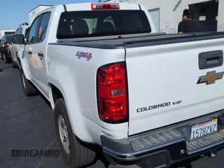 2019 Chevrolet Colorado 4WD Work Truck z VIN 1GCGTBEN7K1210307, wystawiony jako IAAI lot #42550077 z przebiegiem 90 373 mil mil oraz . Historia ofert i sprzedaży dostępna na DreamBid. Obrazek 1.