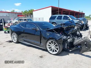 2018 Chevrolet Camaro 1LT z VIN 1G1FB1RX8J0184852, wystawiony jako IAAI lot #42268638 z przebiegiem 99 610 mil mil oraz . Historia ofert i sprzedaży dostępna na DreamBid. Obrazek 1.