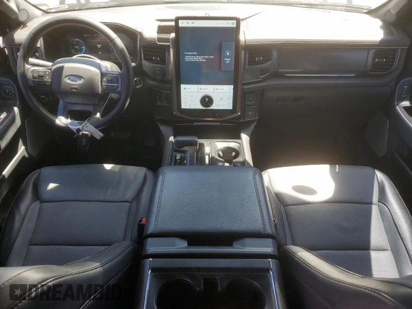 2023 Ford F-150 Lightning Pro with VIN 1FTVW1EV1PWG17333, listed as a Copart auction lot 57904025 with 21,173 mi miles and Salvage title. Bid and sale history available at DreamBid. Image 8.