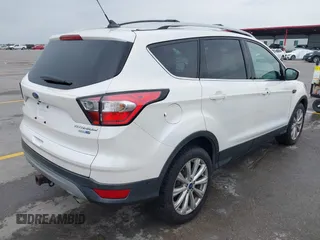 2018 Ford Escape Titanium with VIN 1FMCU9J98JUB87867, listed as a IAAI auction lot 42300123 with 48,357 mi miles and . Bid and sale history available at DreamBid. Image 4.