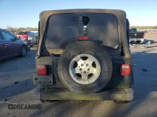 2002 Jeep Wrangler Sahara z VIN 1J4FA59S12P757177, wystawiony jako Copart lot #42808925 z przebiegiem 71 049 mil mil oraz Czysty tytuł • Clean title. Historia ofert i sprzedaży dostępna na DreamBid. Obrazek 6.
