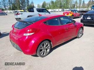 2016 Hyundai Veloster with VIN KMHTC6AD2GU284741, listed as a IAAI auction lot 42108919 with 162,616 mi miles. Bid and sale history available at carsss.com. Image 4.