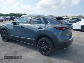 2023 Mazda CX-30 S Carbon Edition with VIN 3MVDMBCM4PM579080, listed as a IAAI auction lot 41941082 with 5,444 mi miles and . Bid and sale history available at carsss.com. Image 3.