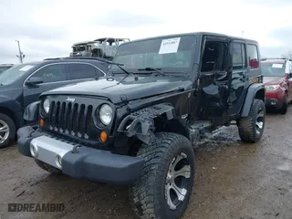 2008 Jeep Wrangler Unlimited Sahara with VIN 1J4GA59128L596561, listed as a IAAI auction lot 41512887 with 166,784 mi miles. Bid and sale history available at carsss.com. Image 18.