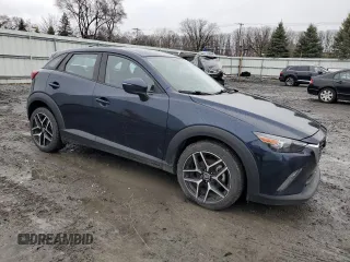 2017 Mazda CX-3 Touring with VIN JM1DKFC71H0164263, listed as a Copart auction lot 48951125 with 96,989 mi miles and Clean Title. Bid and sale history available at DreamBid. Image 4.