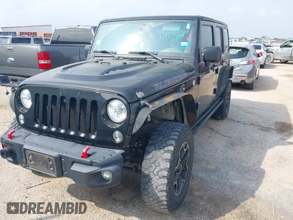 2015 Jeep Wrangler Unlimited Rubicon z VIN 1C4BJWFG2FL572417, wystawiony jako IAAI lot #41895927 z przebiegiem 54 981 mil mil oraz . Historia ofert i sprzedaży dostępna na DreamBid. Obrazek 17.