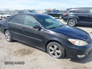 2003 Toyota Camry LE with VIN JTDBF32K730110278, listed as a IAAI auction lot 42033321 with 287,996 mi miles. Bid and sale history available at carsss.com. Image 1.