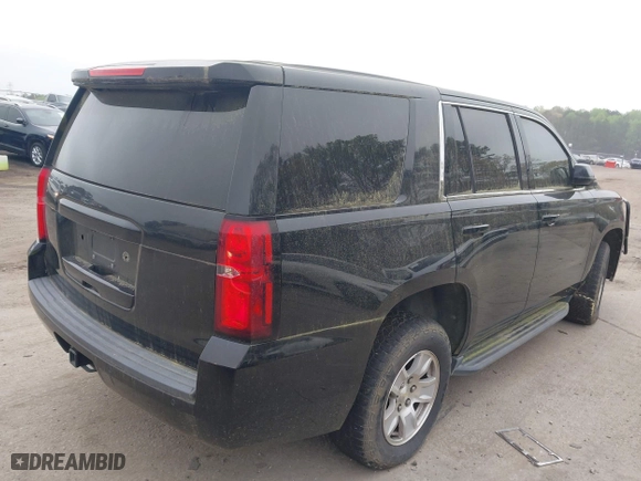 2017 Chevrolet Tahoe Commercial with VIN 1GNLCDECXHR304319, listed as a IAAI auction lot 41924011 with 130,566 mi miles. Bid and sale history available at carsss.com. Image 4.