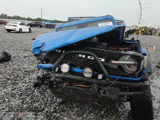 2021 Ford Bronco z VIN 1FMEE5DPXMLB01431, wystawiony jako Copart lot #59192915 z przebiegiem Nie podano mil oraz Nie do naprawy • Non repairable. Historia ofert i sprzedaży dostępna na DreamBid. Obrazek 14.