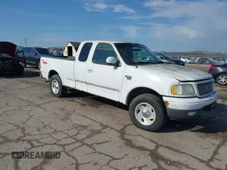 1999 Ford F-150 XL with VIN 2FTRX18L7XCA69231, listed as a IAAI auction lot 41880011 with 1 mi miles. Bid and sale history available at carsss.com. Image 1.