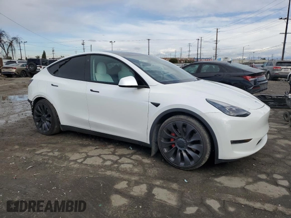 2021 Tesla Model Y Performance with VIN 5YJYGDEF4MF201815, listed as a Copart auction lot 42453075 with 76,888 mi miles and Salvage Title. Bid and sale history available at DreamBid. Image 4.