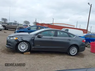 2016 Ford Fusion SE Hybrid with VIN 3FA6P0LU5GR235241, listed as a IAAI auction lot 41697504 with 165,510 mi miles. Bid and sale history available at carsss.com. Image 14.