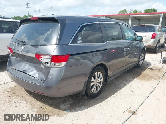 2014 Honda Odyssey EX-L with VIN 5FNRL5H69EB075115, listed as a IAAI auction lot 42046386 with 200,340 mi miles and . Bid and sale history available at carsss.com. Image 4.