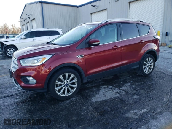 2017 Ford Escape Titanium with VIN 1FMCU0JD7HUD41107, listed as a Copart auction lot 85657084 with 197,982 mi miles and Salvage Title. Bid and sale history available at DreamBid. Image 1.