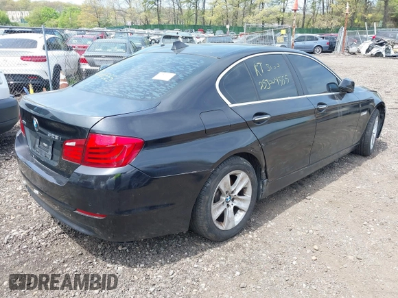 2013 BMW 5 Series 528i xDrive with VIN WBAXH5C55DDW15974, listed as a IAAI auction lot 42185094 with Not provided miles and . Bid and sale history available at DreamBid. Image 4.