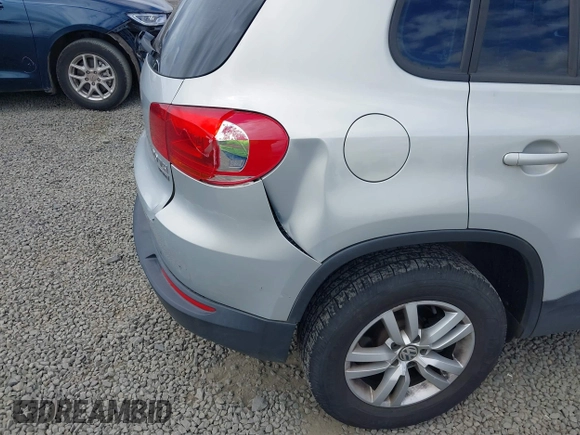 2013 Volkswagen Tiguan SEL with VIN WVGBV3AX1DW571843, listed as a IAAI auction lot 42540191 with 140,639 mi miles and . Bid and sale history available at DreamBid. Image 6.