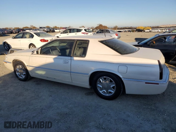2002 Cadillac Eldorado z VIN 1G6EL12Y12B100821, wystawiony jako Copart lot #83495214 z przebiegiem 36 358 mil mil oraz Czysty tytuł • Clean title. Historia ofert i sprzedaży dostępna na DreamBid. Obrazek 2.
