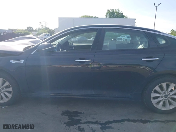 2016 Kia Optima EX with VIN 5XXGU4L3XGG033323, listed as a IAAI auction lot 42088998 with 134,686 mi miles. Bid and sale history available at carsss.com. Image 14.