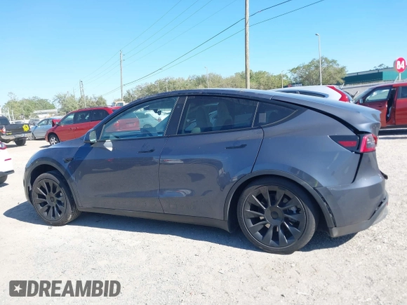 2023 Tesla Model Y Long Range with VIN 7SAYGDEE1PA203937, listed as a IAAI auction lot 41814421 with 9,138 mi miles. Bid and sale history available at carsss.com. Image 13.