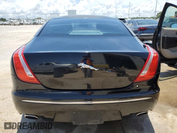 2011 Jaguar XJ with VIN SAJWA1CBXBLV12152, listed as a Copart auction lot 62010855 with 125,697 mi miles and Salvage title. Bid and sale history available at DreamBid. Image 6.