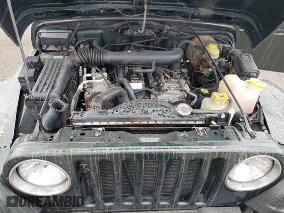 1998 Jeep Wrangler Sahara with VIN 1J4FY49S2WP707318, listed as a Copart auction lot 59508635 with 144,948 mi miles and Clean title. Bid and sale history available at DreamBid. Image 12.