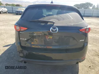 2018 Mazda CX-5 Grand Touring с VIN JM3KFADM2J1310339, выставлен на аукционе Copart как лот 64705245 с пробегом 63 927 миль миль и Списание • Salvage title. История ставок и продаж доступна на DreamBid. Изображение 6.