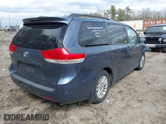 2014 Toyota Sienna XLE with VIN 5TDYK3DC9ES511035, listed as a IAAI auction lot 41884115 with 153,071 mi miles. Bid and sale history available at carsss.com. Image 4.