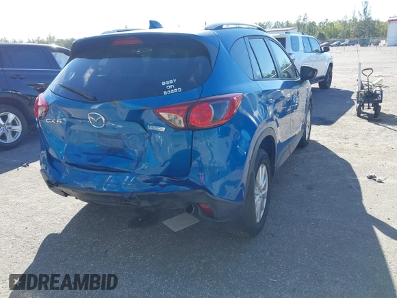 2014 Mazda CX-5 Touring with VIN JM3KE2CYXE0310873, listed as a IAAI auction lot 41309633 with 175,325 mi miles and . Bid and sale history available at DreamBid. Image 12.