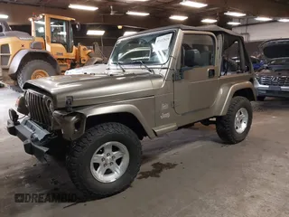 2004 Jeep Wrangler Sahara with VIN 1J4FA59S64P736389, listed as a IAAI auction lot 41432819 with 102,830 mi miles and . Bid and sale history available at DreamBid. Image 17.