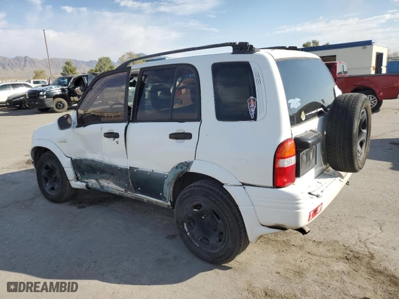 2002 Suzuki Grand Vitara JLX with VIN JS3TD62V824154031, listed as a Copart auction lot 76403684 with 208,529 mi miles and Salvage Title. Bid and sale history available at carsss.com. Image 2.