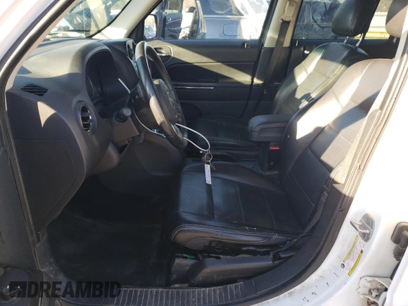 2011 Jeep Patriot Latitude X with VIN 1J4NF4GB4BD239057, listed as a Copart auction lot 85320574 with 180,792 mi miles and Salvage Title. Bid and sale history available at DreamBid. Image 7.