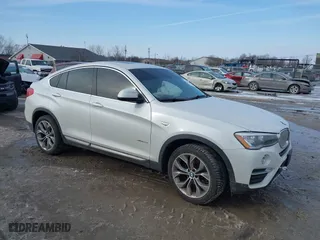 2015 BMW X4 xDrive28i with VIN 5UXXW3C52F0M89272, listed as a IAAI auction lot 41564237 with 75,823 mi miles. Bid and sale history available at carsss.com. Image 1.