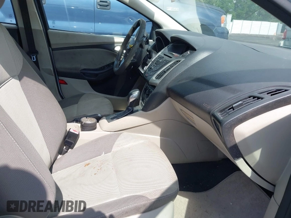 2013 Ford Focus SE z VIN 1FADP3F22DL216627, wystawiony jako IAAI lot #42263314 z przebiegiem 145 937 mil mil oraz . Historia ofert i sprzedaży dostępna na DreamBid. Obrazek 5.