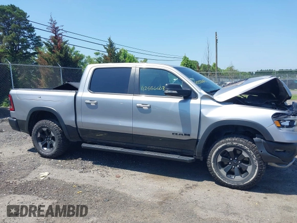 2019 Ram 1500 Rebel with VIN 1C6SRFLT8KN797618, listed as a IAAI auction lot 42556663 with 92,606 mi miles and . Bid and sale history available at DreamBid. Image 13.