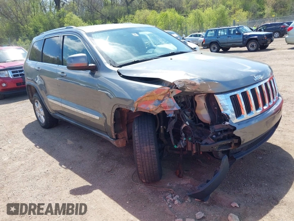 2011 Jeep Grand Cherokee Laredo with VIN 1J4RR4GGXBC587911, listed as a IAAI auction lot 42156885 with 178,999 mi miles and . Bid and sale history available at DreamBid. Image 1.