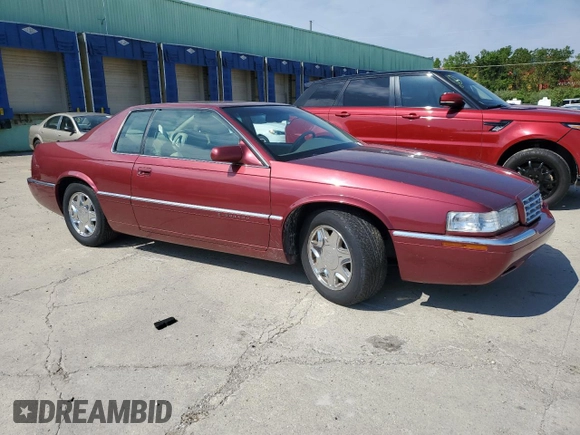 1997 Cadillac Eldorado ESC z VIN 1G6EL12Y5VU614955, wystawiony jako Copart lot #56222345 z przebiegiem 62 030 mil mil oraz Tytuł czysty. Historia ofert i sprzedaży dostępna na DreamBid. Obrazek 4.
