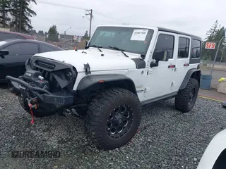 2014 Jeep Wrangler Unlimited Sahara with VIN 1C4BJWEG1EL127232, listed as a IAAI auction lot 41847368 with 109,975 mi miles. Bid and sale history available at carsss.com. Image 2.