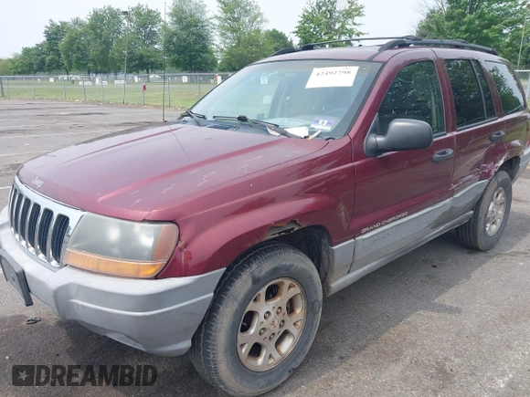 2000 Jeep Grand Cherokee Laredo z VIN 1J4GW48S2YC288439, wystawiony jako IAAI lot #42492798 z przebiegiem 272 527 mil mil oraz . Historia ofert i sprzedaży dostępna na DreamBid. Obrazek 2.
