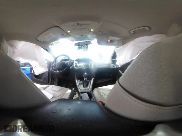 2016 Ford Focus Titanium with VIN 1FADP3N20GL275763, listed as a IAAI auction lot 42511959 with 124,891 mi miles and . Bid and sale history available at DreamBid. Image 18.