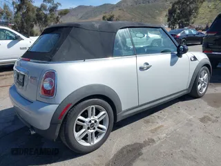 2011 MINI Convertible with VIN WMWZN3C57BT133094, listed as a IAAI auction lot 41711094 with 96,056 mi miles and . Bid and sale history available at DreamBid. Image 4.
