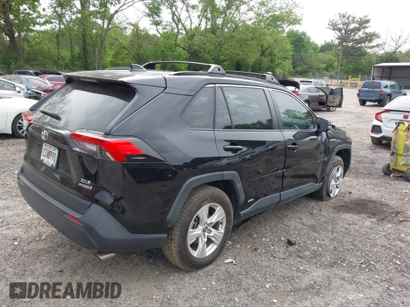 2021 Toyota RAV4 Hybrid XLE with VIN JTMRWRFV2MD133113, listed as a IAAI auction lot 42087394 with 103,019 mi miles and . Bid and sale history available at DreamBid. Image 4.