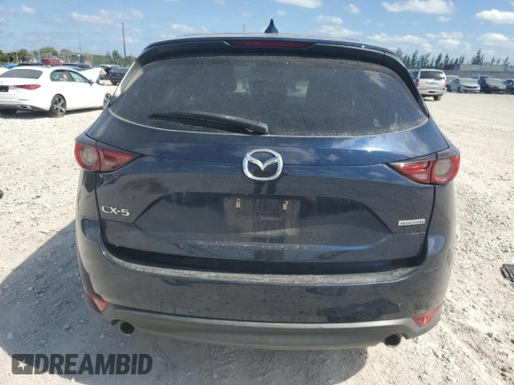 2021 Mazda CX-5 Grand Touring with VIN JM3KFADM1M0301366, listed as a Copart auction lot 52890955 with 66,686 mi miles and Non Repairable. Bid and sale history available at carsss.com. Image 6.