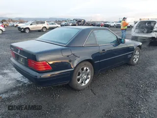 1996 Mercedes-Benz SL-Class with VIN WDBFA67F8TF129267, listed as a IAAI auction lot 41200768 with 104,836 mi miles. Bid and sale history available at carsss.com. Image 4.