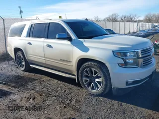 2015 Chevrolet Suburban LTZ with VIN 1GNSKKKCXFR128490, listed as a IAAI auction lot 41461579 with 260,669 mi miles. Bid and sale history available at carsss.com. Image 1.