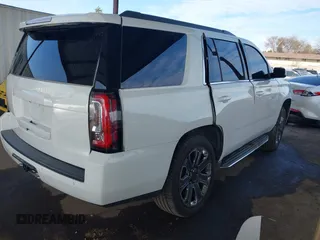 2019 GMC Yukon SLT with VIN 1GKS2BKC5KR109529, listed as a IAAI auction lot 41559860 with 136,025 mi miles. Bid and sale history available at carsss.com. Image 4.