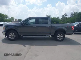 2018 Ford F-150 XL with VIN 1FTEW1E57JFA95086, listed as a IAAI auction lot 42574704 with 77,301 mi miles and . Bid and sale history available at DreamBid. Image 14.